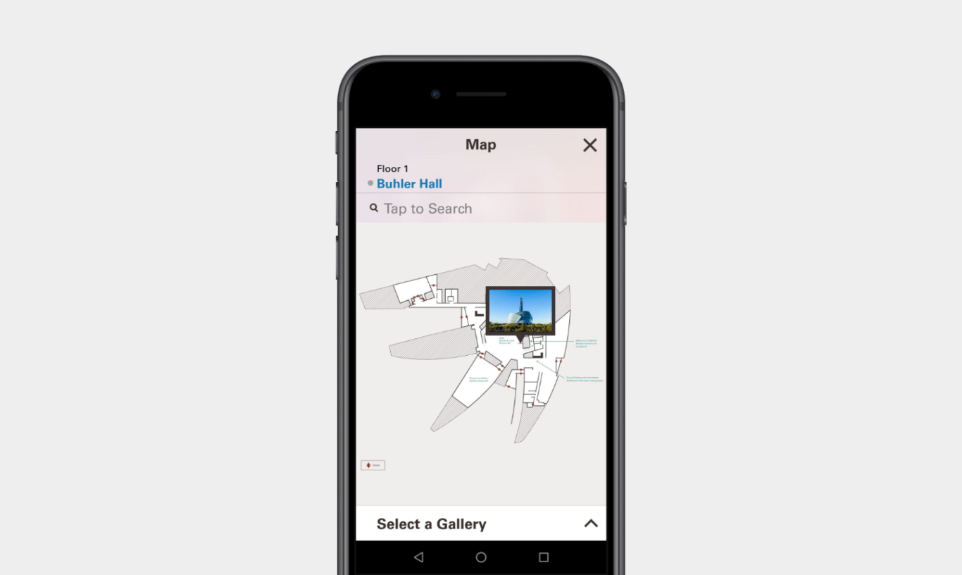 A mobile phone mockup of a map of an unusually shaped, four-elled building is overlaid with a small, blue thumbnail. The map is labeled "Floor 1: Buhler Hall." There is also a search field and X to close the window.